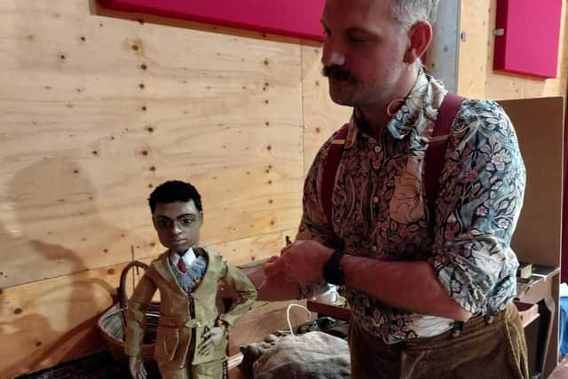 Director of puppetry, Samual Wyer, is pictured with the puppet of Kay Harker