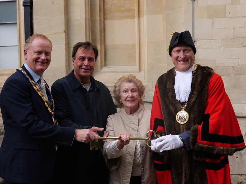 Banbury Town Mayor Mark Cherry and Cherwell District Council chair Cllr Nigel Simpson officially open the fair alongside members of the Wilson family.