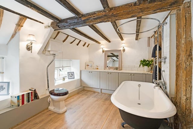 The house has a large updated family bathroom with a roll top claw and ball bath with shower over, wash basin.