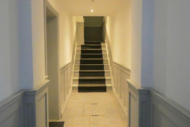 The property's entrance hall has engineered oak flooring and a security entry phone and video camera screen.