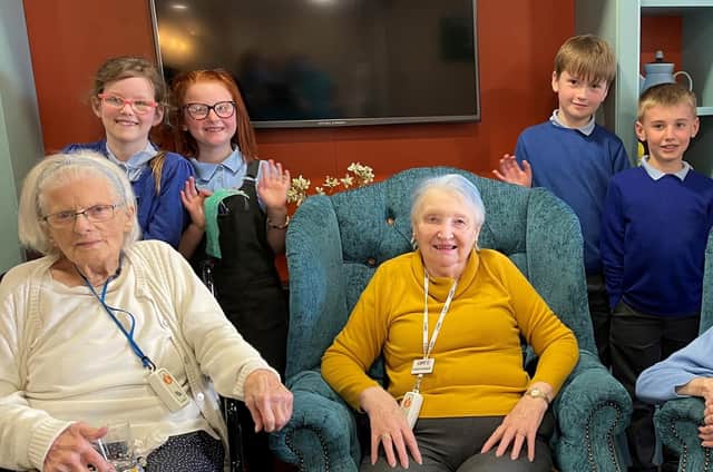 Highmarket House care home residents Kath Johnston and Janet Wood with local nursery children (photo from Highmarket House)
