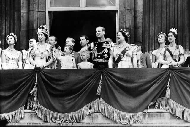 Britain's Queen Elizabeth II, accompanied by Prince Philip, Duke of Edinburgh (C), Prince Charles, Princess Anne, Queen mother Elizabeth and Princess Margaret, appears on the balcony of Buckingham Palace, on Coronation day, on June 02, 1953