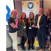 Banbury mum and swim school owner, Tamsin Brewis, speaks out on importance of exercise in children and young people for World Health Day on April 7 (pictured Tamsin Brewis (far left) with the late Steve Franks, former CEO of Water Babies.) photo from Water Babies swim school.