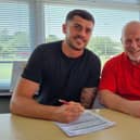 Jack Davies, pictured with chairman Ronnie Johnson, has been confirmed as Banbury United's first summer signing. Picture courtesy of Banbury United FC