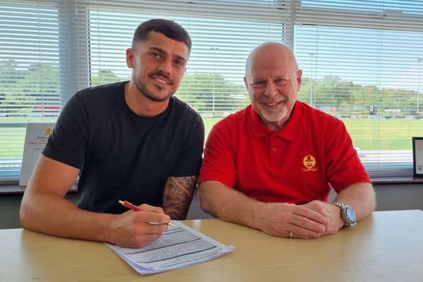 Jack Davies, pictured with chairman Ronnie Johnson, has been confirmed as Banbury United's first summer signing. Picture courtesy of Banbury United FC