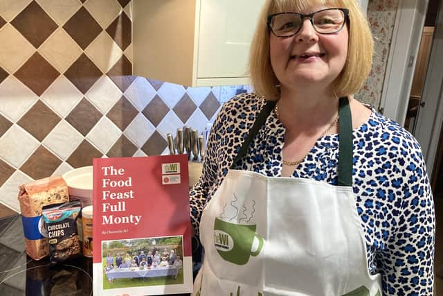 Alison Castle, President of Chacombe WI, is pictured with the group's new recipe book