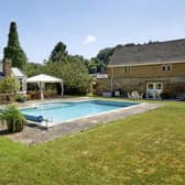 The house has an enclosed pool garden with stone pool house and outdoor heated swimming pool ideal for entertaining.