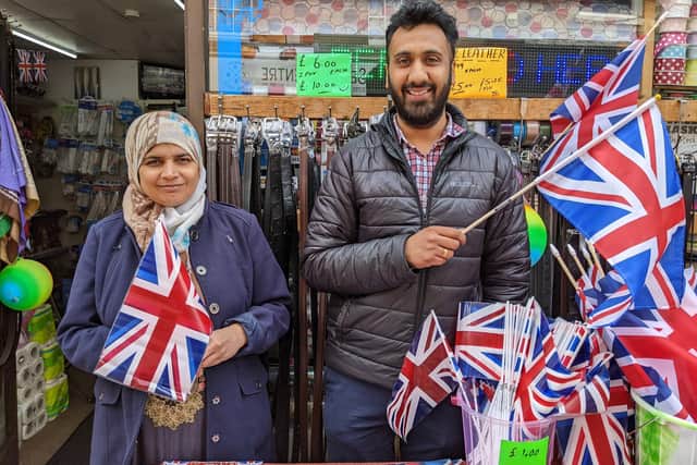 Nighat Bibi and Robit (Rocky) Bansal, owner of Bargain Village, Parsons Street which has done a roaring trade in flags, bunting and other Jubilee paraphernalia