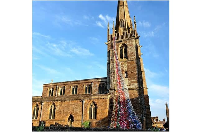 A photo of the flower tower consisting of more than 4,300 handmade flowers at All Saints Church in the village of Middleton Cheney. (photo by Jacqueline Munday)