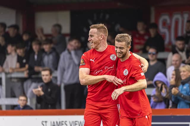 Callum Stead is congratulated by Adam Rooney after scoring one of his two goals in last weekend's 2-0 home win over Buxton. Picture by Glenn Alcock