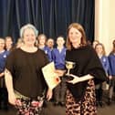 Holy Trinity School Choir receiving their award at the 2023 Festival