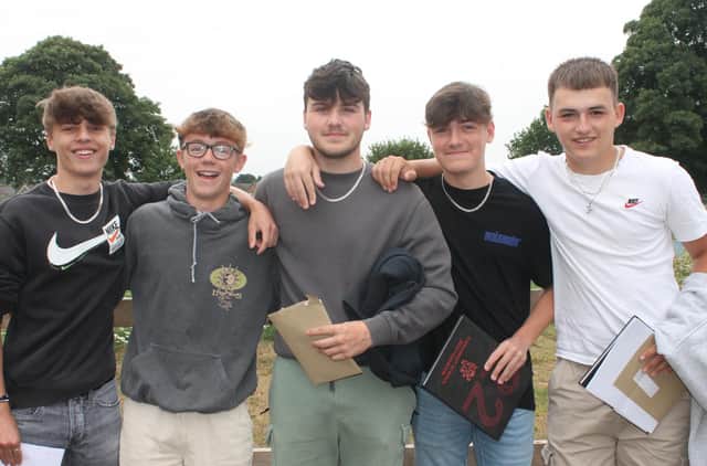 A group of happy Chenderit School students on results day.