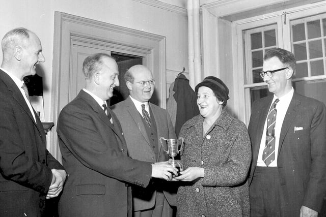 Miss Janet Oldham and Mr D Louden receive the Alice Cleary Trophy in the Waverley Station Ambulance Company First Aid Competition in December 1962.