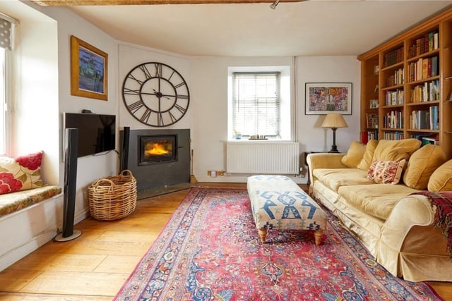 The study room with fireplace and bookshelves.

Photo: Savills