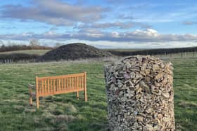Stone gabion for engraved memorial leaves in the ground of the Barrow