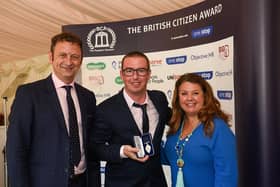 Michael Hampton was presented with the British Citizen Award by TV presenter Matt Allwright and Lisa Collins of Objective HR.