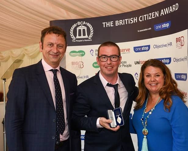 Michael Hampton was presented with the British Citizen Award by TV presenter Matt Allwright and Lisa Collins of Objective HR.