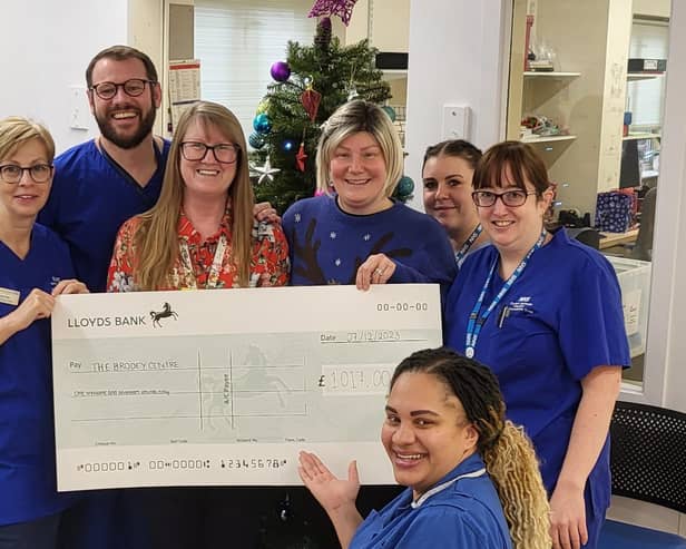 Kelly handed over a cheque for over £1,017 to the Brodey Cancer Centre.