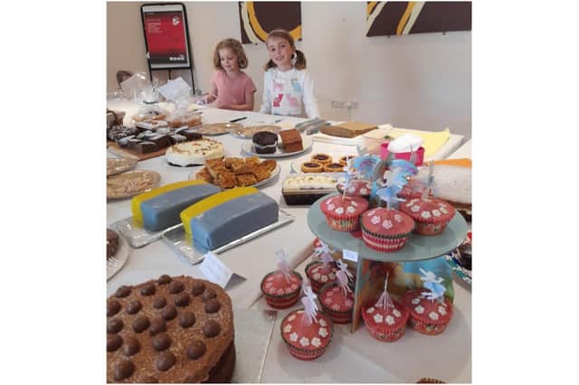 Banbury area school girl seven-year-old Charlotte (at right) organised a village cake sale to help children in Ukraine. (photo from Charlotte's mother, Louise Coopman)