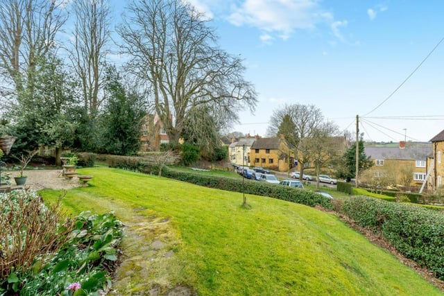 The front garden overlooks the picturesque village of Great Bourton.