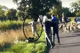 A still from the video that shows a huntsman (circled) throwing protester's car keys over a hedge and into a field.