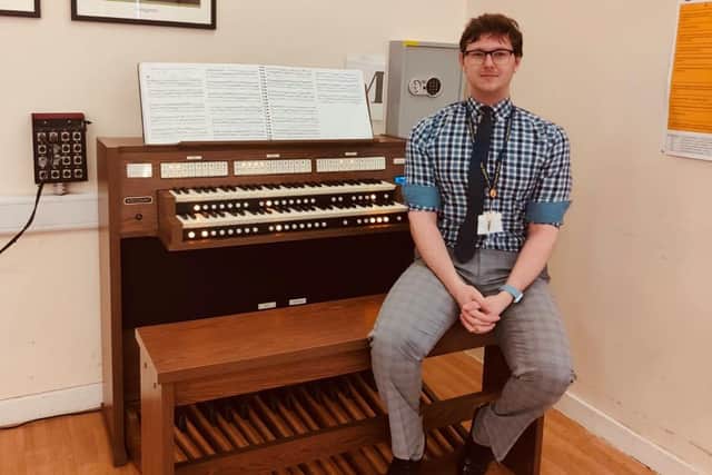 Teacher of music, Dylan McCaig, with The Warriner School's new electronic organ (courtesy of the Royal College of Organists and Viscount Organs)
