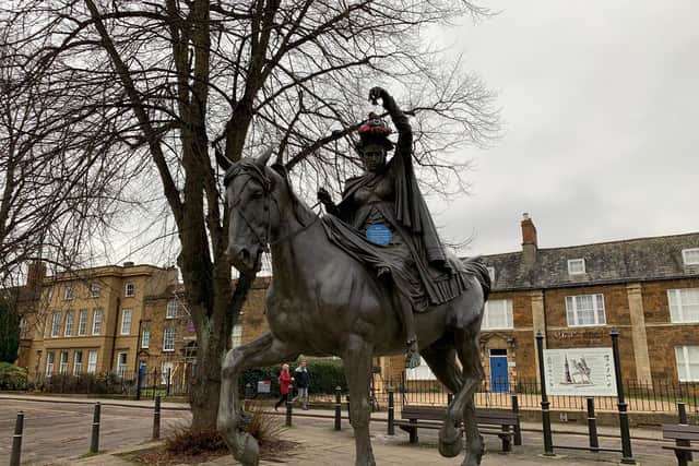 The blue plaque created by Extinction Rebellion is put on Banbury's statue of the Fine Lady on a White Horse