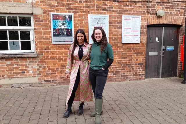 Jasmine Gilhooly the Banbury BID Strategist and Felicity Brain a town host for Banbury BID stand together outside The Mill Arts Centre in Banbury.