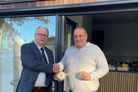 Cllr Martin Phillips handing over the keys to the new café in People's Park to Carl Fox.