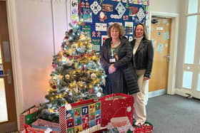 Toni Mee and Sarah Loak from Chiltern Railways with some of the donated Christmas gifts.