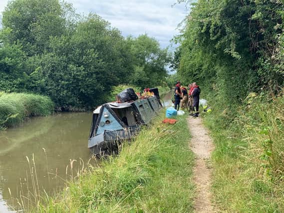 Fire and rescue crews helped to right this listing canalboat