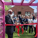 Banbury Town Mayor Fiaz Ahmed cuts the ribbon to officially open the Grimsbury Community Centre's new garden.