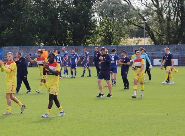 The Banbury United players applaud the travelling fans after they started life in the Vanarama National League North with a 2-1 win at Curzon Ashton. Picture by Julie Hawkins