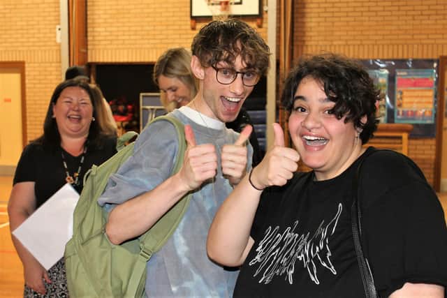 Chenderit School students Jamie Cook and Yousra Radi celebrate their A level results.