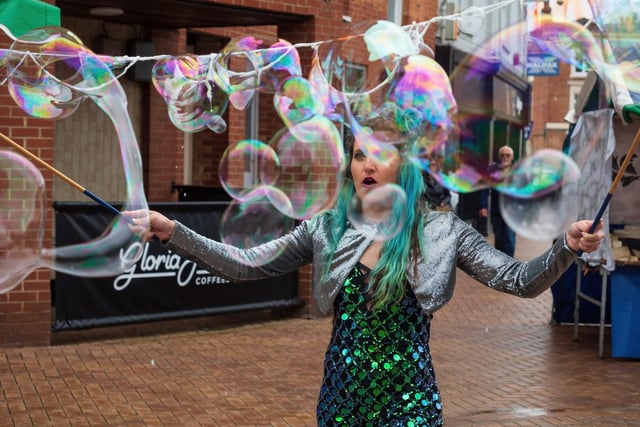 Performers blew bubbles and crafted balloons to create the party vibe in the town centre.