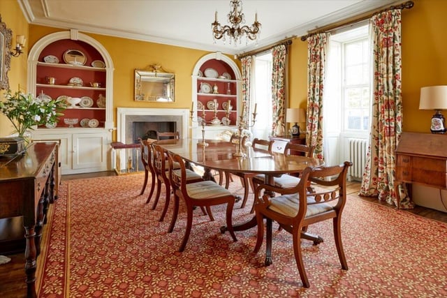 The classy property contains impressive dining room featuring large windows.