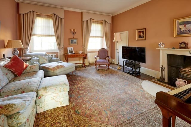 The property contains a beautiful large drawing room with an open fireplace.