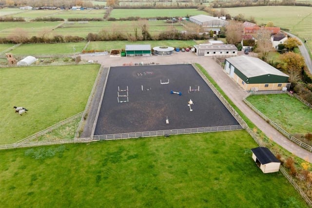 A photo of the extensive yard and equestrian facilities that come with the property.