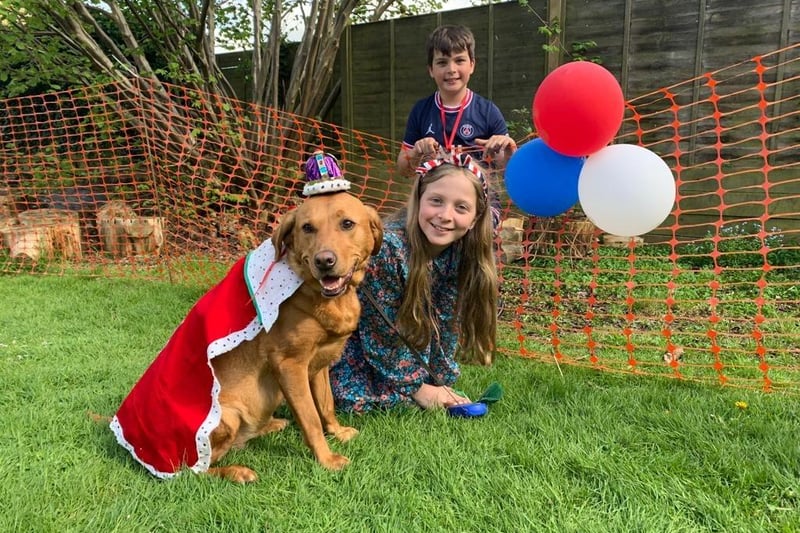 Emily and Henry Benton with Poppy, who won the dogs' fancy dress competition at Hook Norton