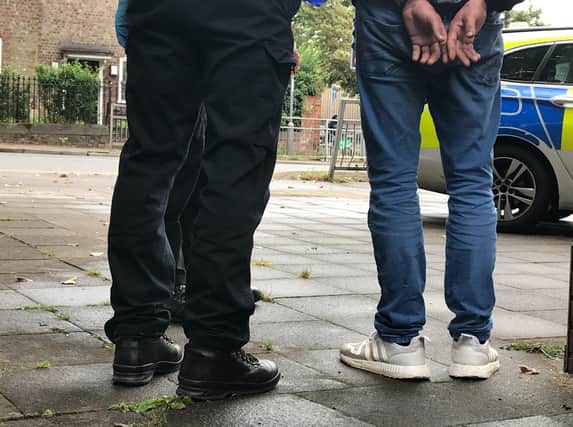 The police arrested a 12-year-old boy on Saturday after a man and a woman were assaulted outside a shop in Banbury.