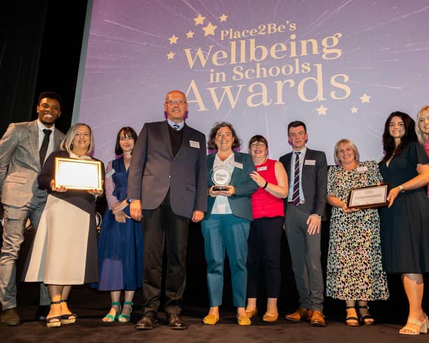 Rhys Stephenson, Katie Thistleton and Chris Reay with the Scool Award for Mental Health Excellence (Primary) Finalists at the Place2Be's Wellbeing in School Awards 2022
