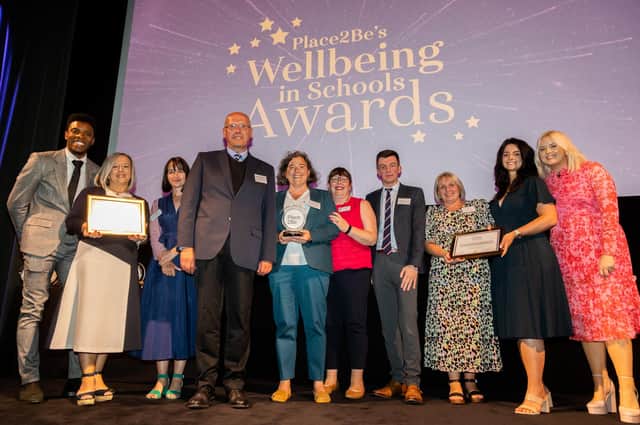 Rhys Stephenson, Katie Thistleton and Chris Reay with the Scool Award for Mental Health Excellence (Primary) Finalists at the Place2Be's Wellbeing in School Awards 2022