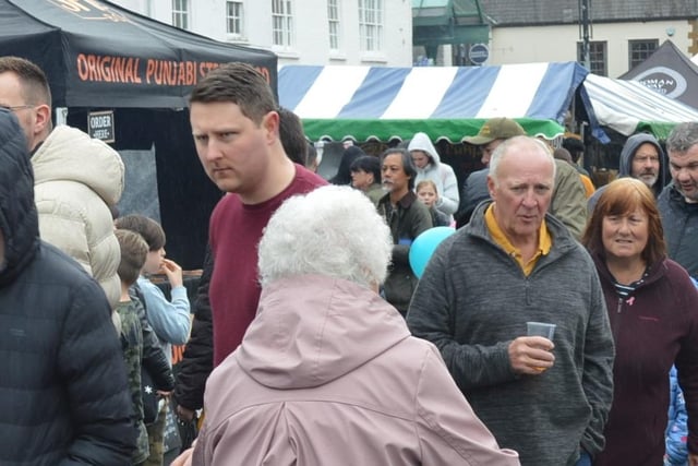 Visitors enjoyed the festival's delightful delicacies despite the wet weather.