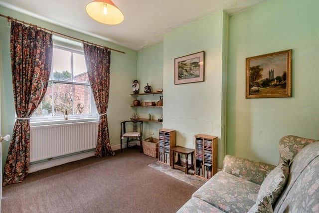 The second bedroom features a front sash window providing views over the village.