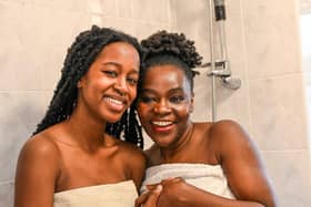 Psychologist Angela Karanja, 48, right, and daughter Dee,18, shower and bath together to promote body positivity