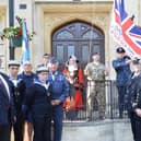 Members of the armed forces raising the flag at Banbury Town Hall last year.