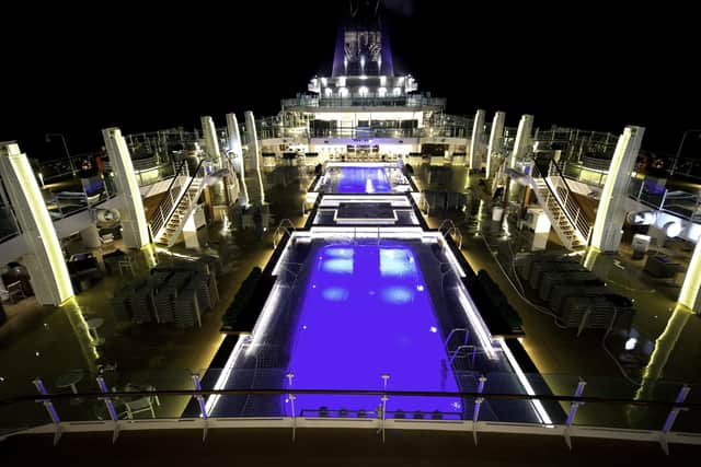The Lido Deck lit up at night on Britannia.