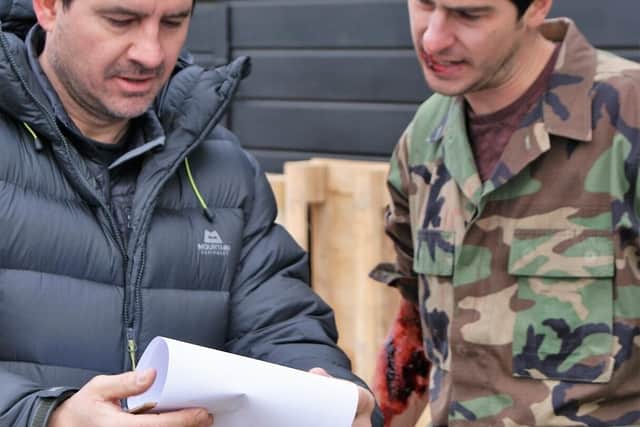 Bite director James Owen pictured on set in discussion about the script, co-written with Tom Critch