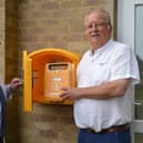 Cllr Phillips (right) and Paul Almond, the town council’s Environment Officer, examine the defib at Horton View sportsground.