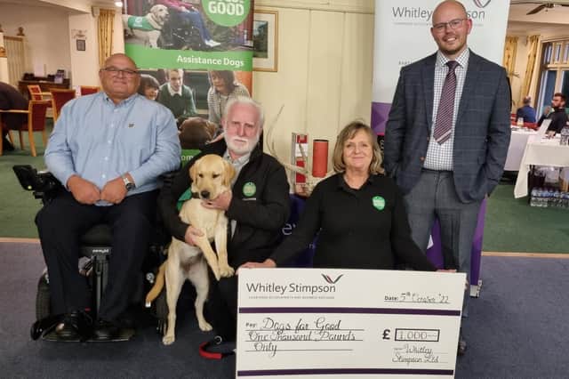 Banbury accountancy company raise £1,000 for charity Dogs for Good.